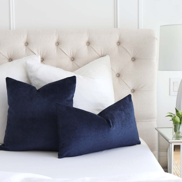 https://www.chloeandolive.com/cdn/shop/products/Kelly-Wearstler-Lee-Jofa-Rebus-Aegean-Indigo-Blue-Textured-Velvet-GWF-3766-550-Designer-Luxury-Throw-Pillow-Cover_scenic_bed_600x.jpg?v=1661875736