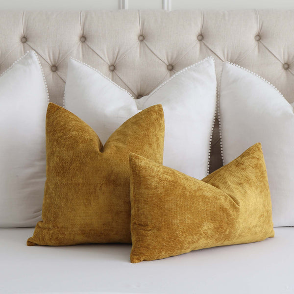 https://www.chloeandolive.com/cdn/shop/products/Kelly-Wearstler-Lee-Jofa-Rebus-Glint-Gold-Textured-Velvet-GWF-3766-4-Designer-Luxury-Throw-Pillow-Cover_scenic_bed_600x.jpg?v=1652243536