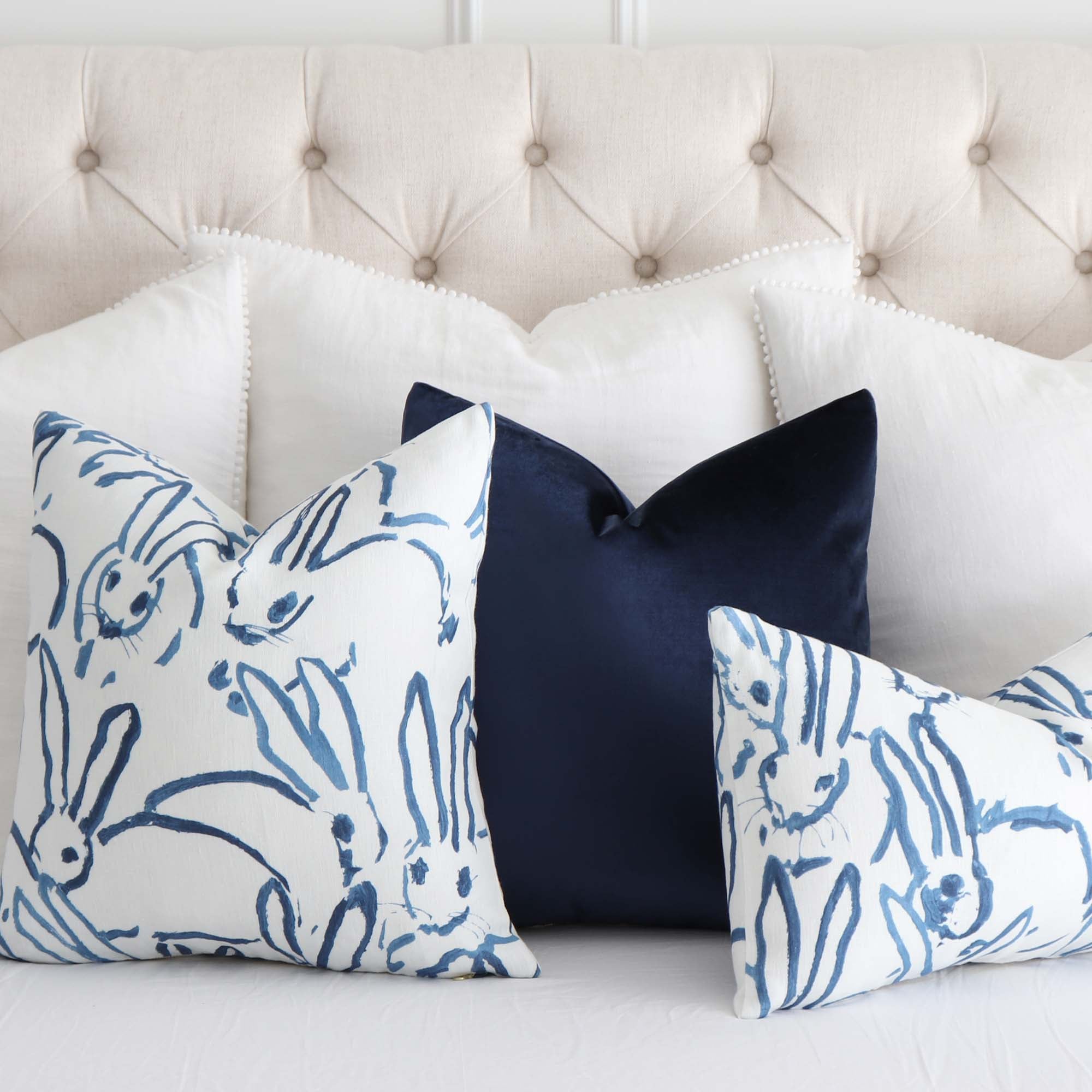 https://www.chloeandolive.com/cdn/shop/products/Lee-Jofa-Groundworks-Hutch-Bunny-Navy-Blue-Designer-Luxury-Throw-Pillow-Cover-GWF3523-On-Bed_5000x.jpg?v=1618019213