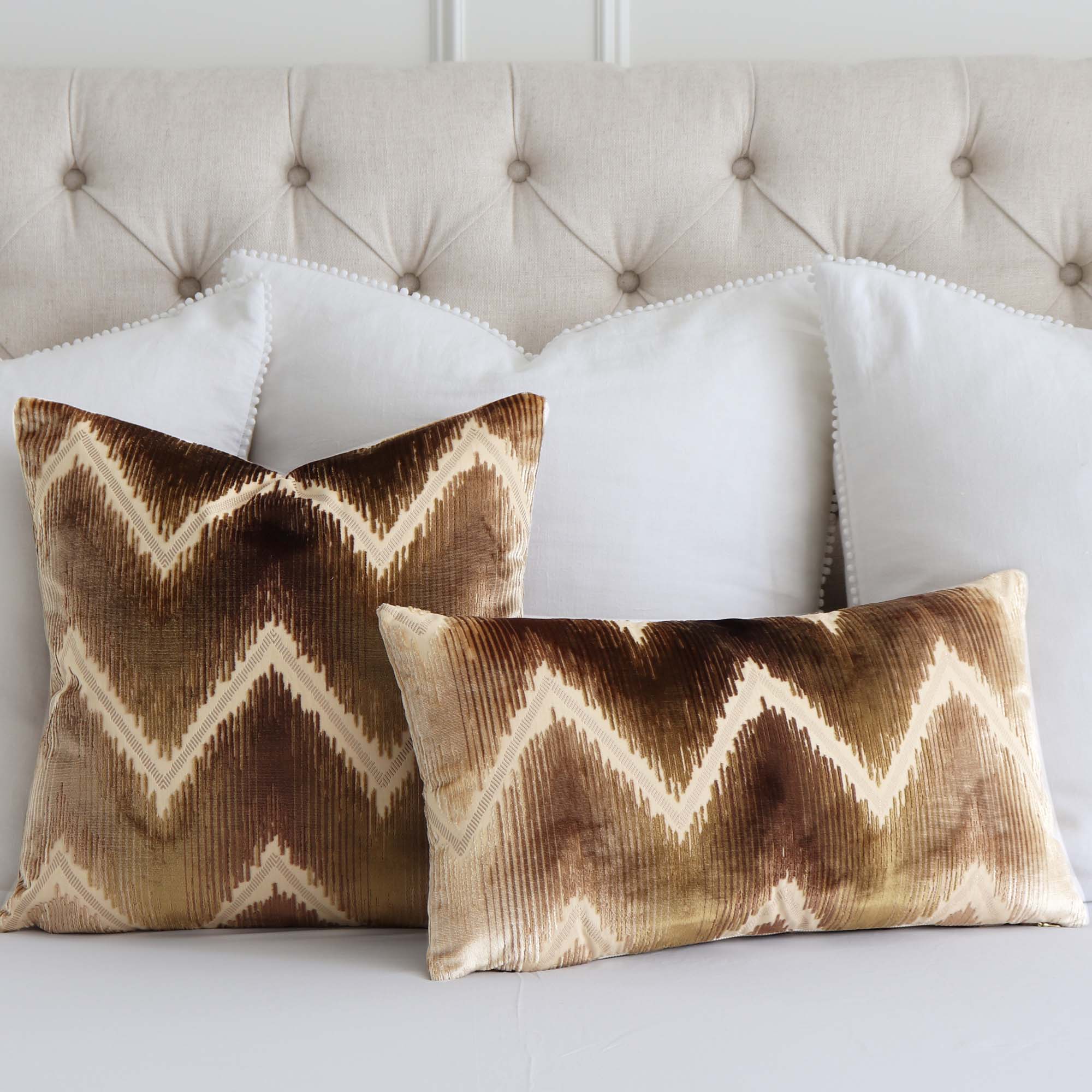 https://www.chloeandolive.com/cdn/shop/products/Schumacher-Shock-Wave-Sand-Sable-54861-Velvet-Textured-Designer-Luxury-Throw-Pillow-Cover_scenic_bed_pillows_5000x.jpg?v=1628610920