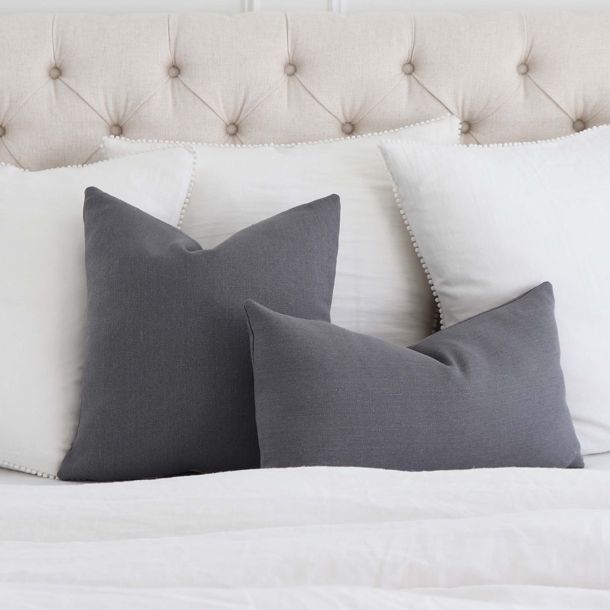 https://www.chloeandolive.com/cdn/shop/products/Tay-Gustave-Dark-Gray-Solid-Color-Linen-Designer-Throw-Pillow-Cover-on-Bed-With-Euro-White-Linen-Pillows_5000x.jpg?v=1616261714