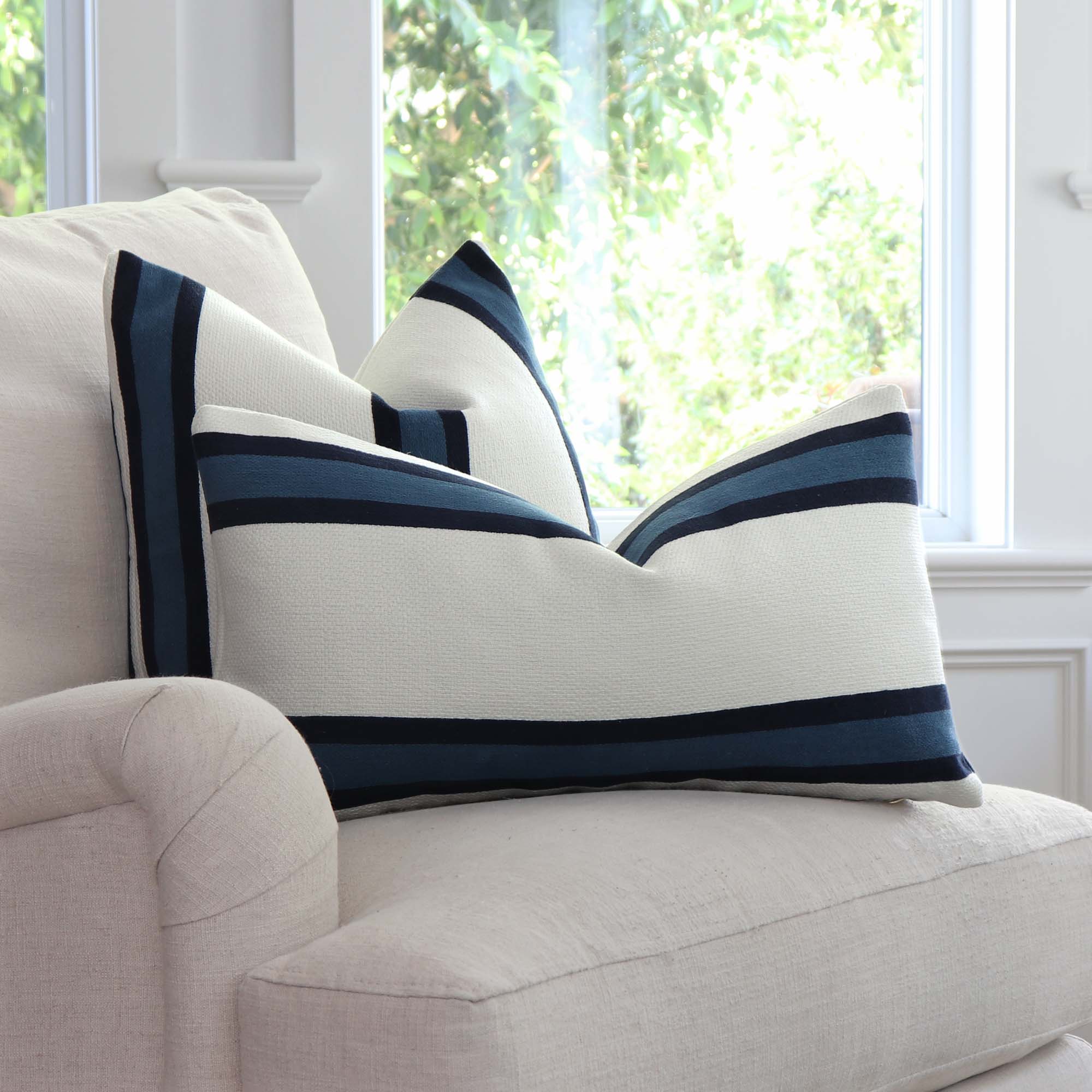 https://www.chloeandolive.com/cdn/shop/products/Thibaut-Abito-Navy-Blue-Stripe-W77142-Designer-Luxury-Throw-Pillow-Cover_scenic_chair_5000x.jpg?v=1662691822