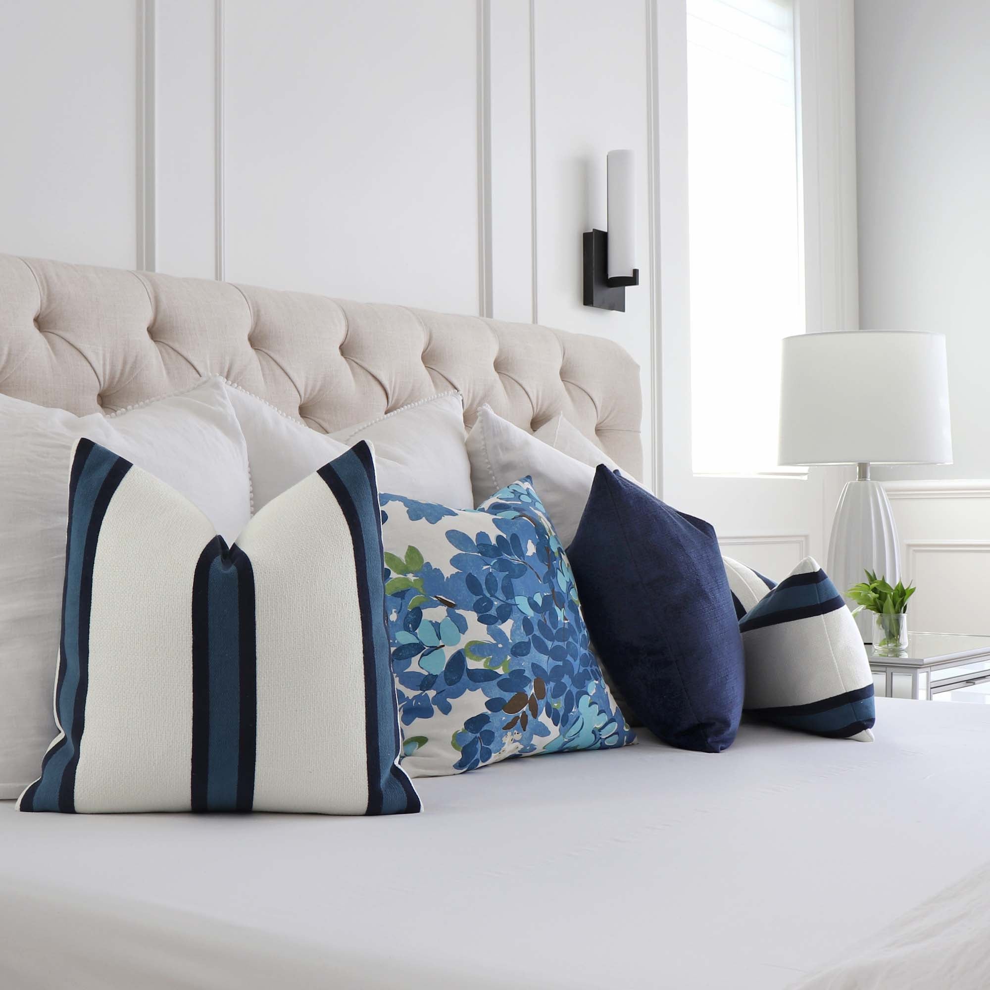 https://www.chloeandolive.com/cdn/shop/products/Thibaut-Abito-Navy-Blue-Stripe-W77142-Designer-Luxury-Throw-Pillow-Cover_scenic_pillowscape_2000x.jpg?v=1662691822