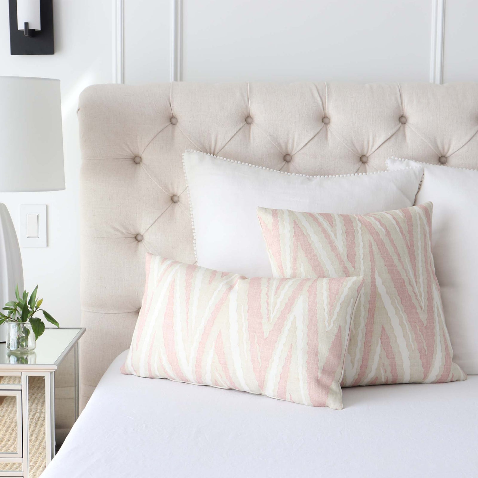 White bed with online pink pillows