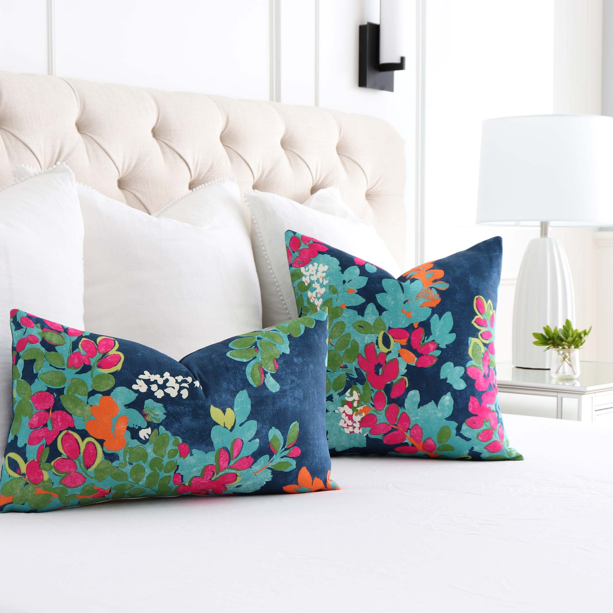 https://www.chloeandolive.com/cdn/shop/products/Thibaut-Central-Park-Floral-Navy-Pink-Designer-Luxury-Throw-Pillow-Cover-in-Bedroom_2000x.jpg?v=1619295428