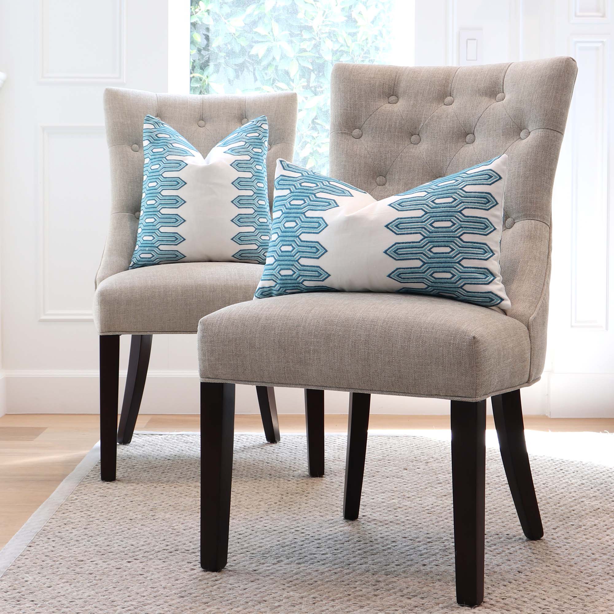 https://www.chloeandolive.com/cdn/shop/products/Thibaut-Nola-Stripe-Embroidery-W720811-Aqua-Blue-Geometric-Designer-Luxury-Decorative-Throw-Pillow-Cover-on-Dining-Chairs-in-Living-Room_2000x.jpg?v=1649393103